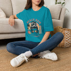 Beach Hair Don't Care T-Shirt – Messy Bun Beach Girl Graphic Tee | Funny Coastal Summer Shirt | Retro Surf Vacation Gift